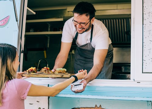 Woman paying for food with smart watch